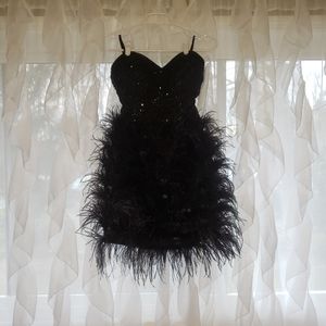 Black feather Cocktail dress. Size 4. Strapless. Only worn once!